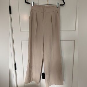 Bone colored slightly wide leg trouser pants with stretch waistband
